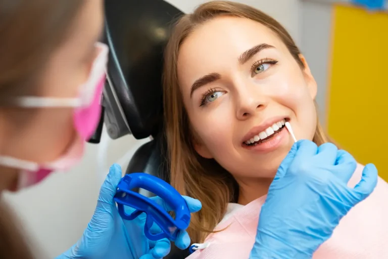 dentist applies plaque detector on front teeth in 2024 02 27 17 28 20 utc